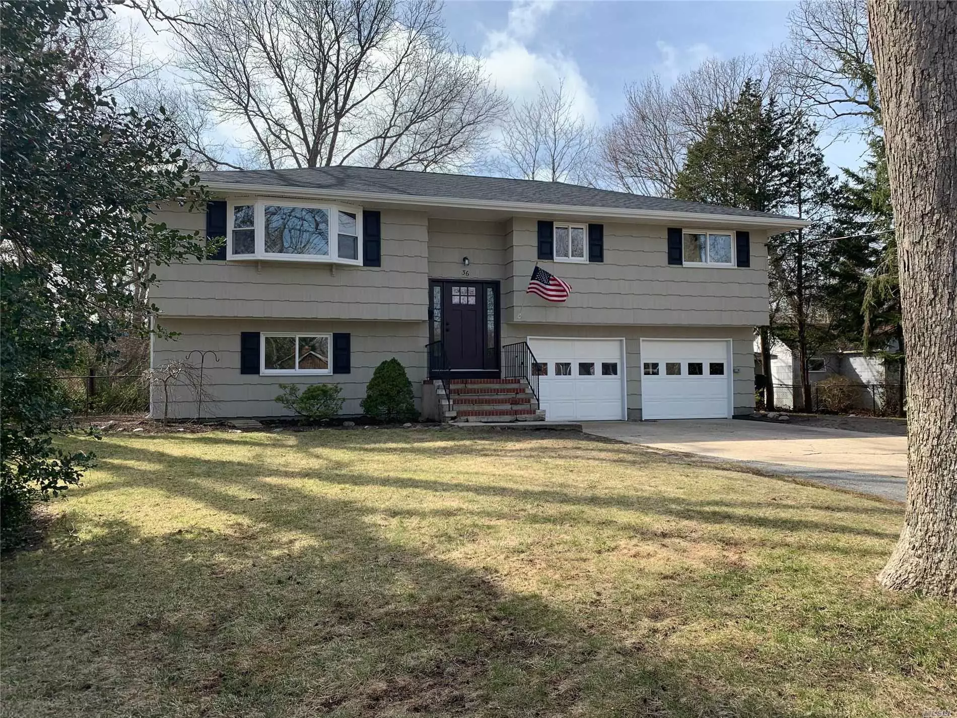 Beautiful High Ranch, Completely Renovated Featuring 5 Bedrooms And 2 Baths. This One Will Not Last Long!