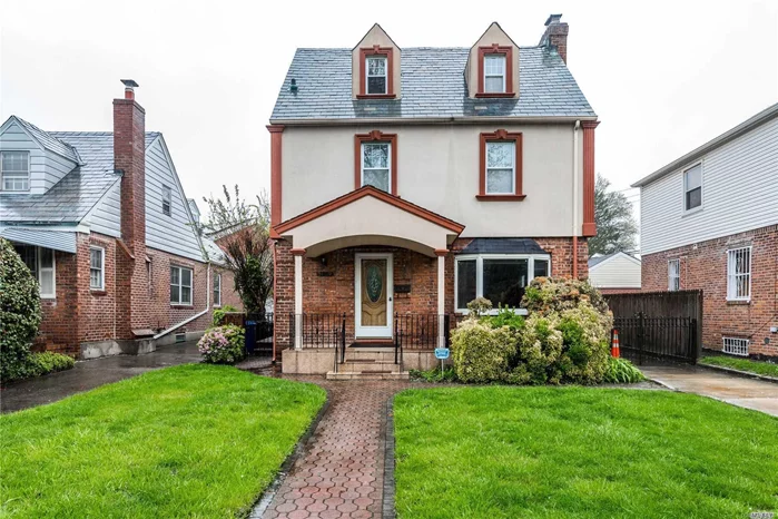 Bayside Hills! Spacious Brick/Stcco Gross Morton Model D features Largest Living Space Sq Ft. Finished 4 Level Colonial. Main Fl-LR w/fplc, FDR, EIK, 1/2 Bath. 2nd Fl offers 3 Large Bdrms, 1 Full Bath w/Sep Shower&Spa Air Tub. Fin Stand Up Attic-Hi Ceilings&Windows 2 More Bdrms/Office/Playrm. Fin Bsmt w/Fam Rm/Office&Full Bath. Sunny Rooms & Lovely Curb Appeal w/Undrgrnd Utility Poles.1 Car Gar, Extra Long Driveway, Private Yard&Patio, Newer Wndws, Closets, Oak Floors, Motion/Lgt Det. Sch Dist 26, Trnsport-LIRR, Buses