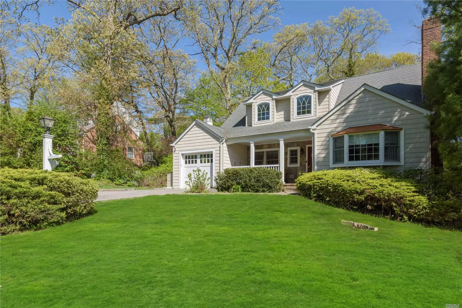 East Hills. Beautiful & timeless this well maintained colonial is in the heart of Norgate. A sun-drenched home that boasts a living room with fireplace, formal dining room, large eat-in kitchen, full finished basement, brick patio, new Bosch dishwasher, beautiful window treatments & office with windows all around. One of the most desired locations with membership to East Hills park & pool.