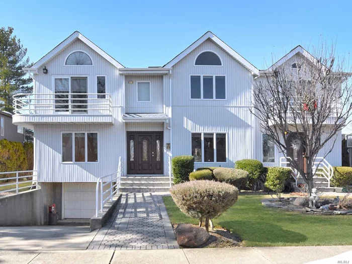 Beautifully Updated Colonial In Manorhaven. Full XL Finished Basement With.5 Bath, Living Room With Fireplace, Master Bedroom With Vaulted Ceilings And Balcony With Waterview.