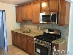 Nice size 2 bedroom 1 bath walking distance to the Bayside L.I.RR station and Bell Blvd shops. The apt features all oak hardwood floors, SS Kitchen appliances, L-shape living room/dining room, balcony, all utilities included except electric and comes with 1 parking spot.