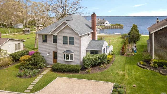 Rare Opportunity to own a home with Sandy Bay Beach and wiith your own boat slip right in front of your house in prestigious Bayfront North Fork community. Amazing Bayfront, harbor view and sunsets! Outdoor dining- Enclosed and Open Air deck. Kayak and paddle board.