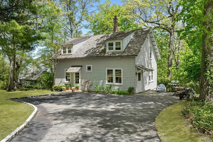 Wonderfully Private Updated 4 Bedroom Cottage On A Serene, Secluded Setting w/ Partial Water Views. Full House Generator, Snow Plowing & Landscaping Included.