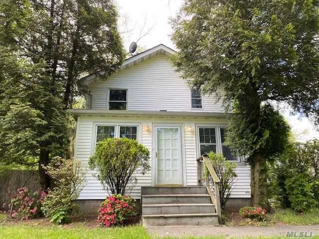 Located in the heart of Port Jeff Station, this 4 bed 2 bath Colonial is just waiting to be seen. With a brand new kitchen featuring white cabinets, and stainless steel appliances. It is the perfect balance between modern and homey. The brick faced fireplace is perfect for winter months & saving on fuel costs. The updated bathrooms include a new vanity, custom tile work, and a beautiful glass bath tub. New paint and carpet through out. Updated windows, roof, siding and boiler. Full unfinished basement for extra storage space with a private outside entrance. Located close to 25A and the LIRR for easy commuting, public transport, and shopping. Plenty of entertainment in PJV including the marina, restaurants, shops and ferry.