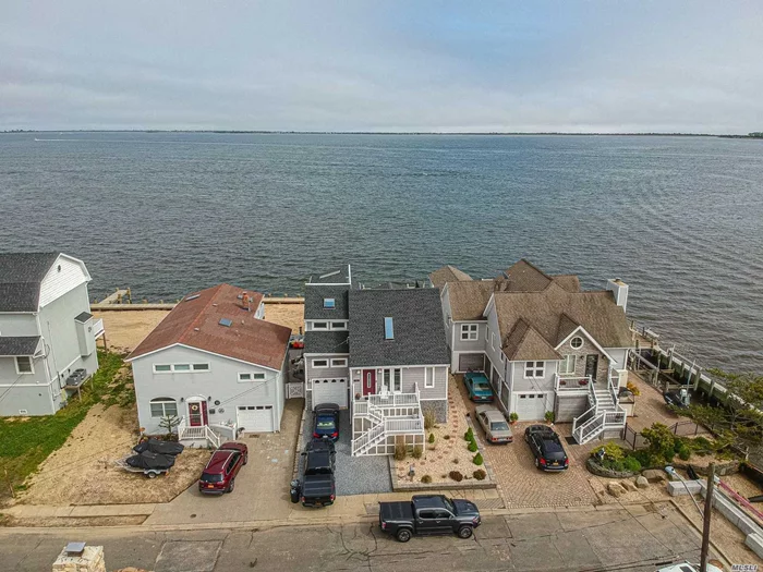 Fred Shore&rsquo;s bayfront, all new, raised after sandy, $510 Fema flood, heated garage, new gas heating, direct vent on demand, 3 ductless split systems, 40&rsquo; new navy bulkheading, full basement, large master suite with full bath and second story deck overlooking the great south bay, 3 new bathrooms, new kitchen with granite tops and stainless steel appliances, gas fireplace, rear decking with hot tub and pool, custom cement patio, entertainment wet bar, Heated salt water pool. Year round hot tub, Natural gas fireplace with 35, 000 BTU heat, 3 ductless A/C split systems with Heat Pumps
