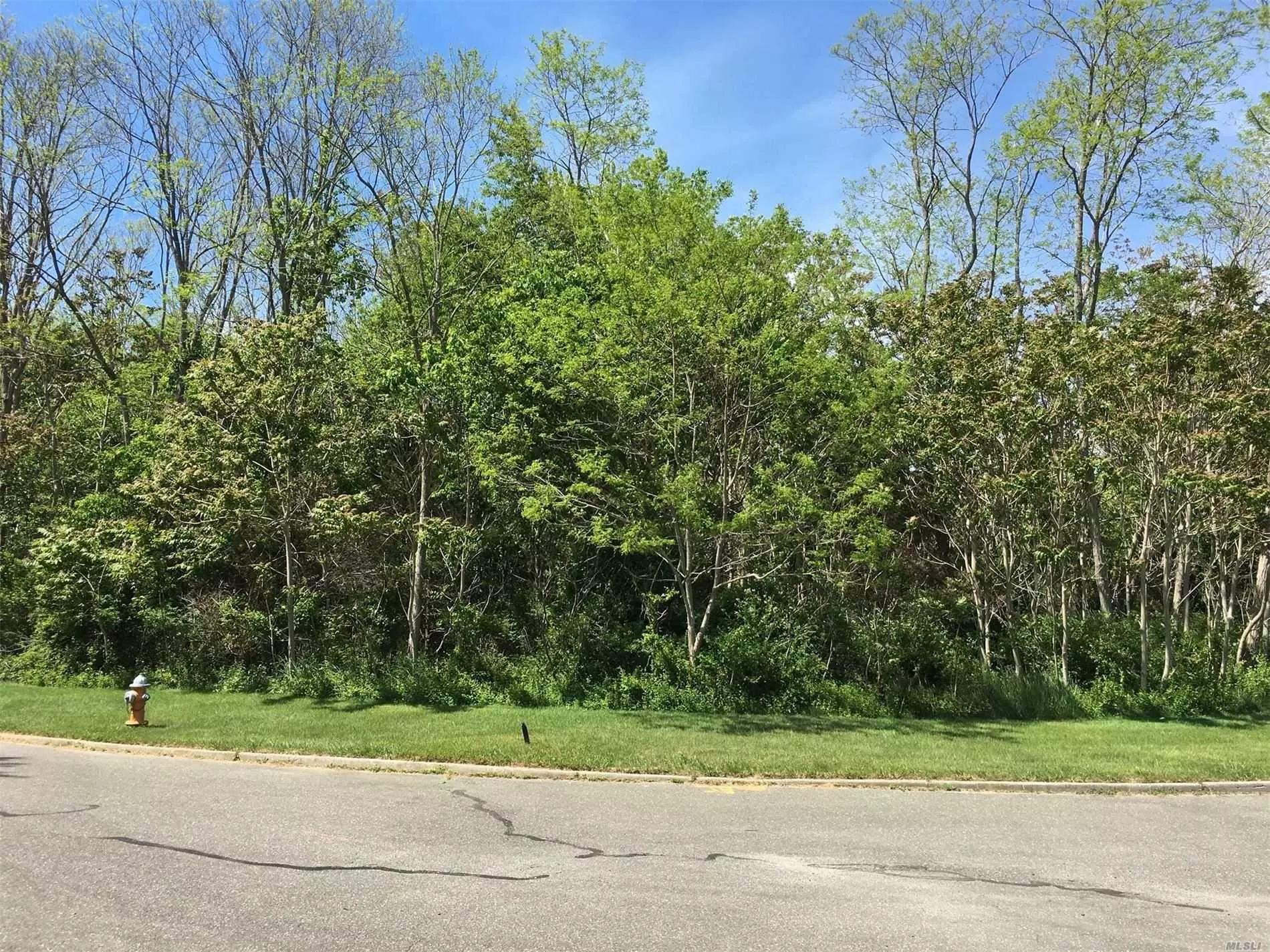 Shy Acre Building Lot In Peaceful, Upscale Cul-De-Sac Neighborhood Off Peconic Bay Boulevard. Comes With 2 Deepwater Boat Slips And Direct Bay Access.