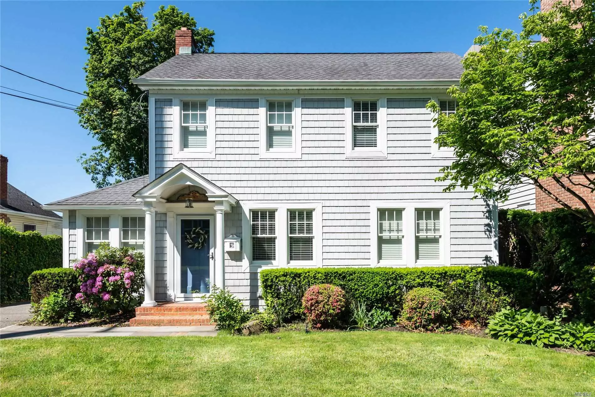 Welcome to this charming Colonial located in the heart of North Syosset with a mid-block location. Beautiful European kitchen renovated 7 years ago with an open layout. Featuring gas cooking & top of the line amenities. Large Living Room w/fireplace adjoining to a sun room for versatile living. Andersen windows & Roof replaced approx 10 years ago. Newly renovated finished basement with gas fireplace. Updated electric in entire home. A Must See, close to shopping, LIRR & town.