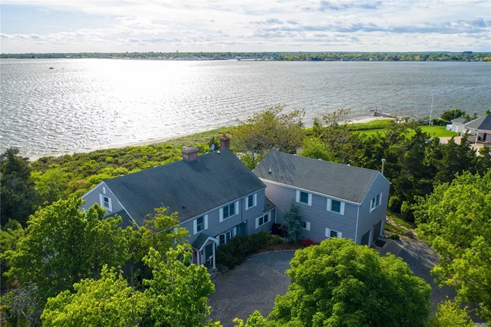 1.58 acre bayfront, X Zone for flood, no Fema flood required, no past history of flooding, high and dry!!! sandy beach overlooking the Great South Bay and the fire Island Bridges, Spectacular Sunsets, Seclude property, gorgeous gunite inground pool with swim lane, enormous kitchen with fireplace, living room with fireplace, formal dining room with fireplace, wood floors, sun room, 5 bedrooms, 4 full bathrooms and 3 half baths.