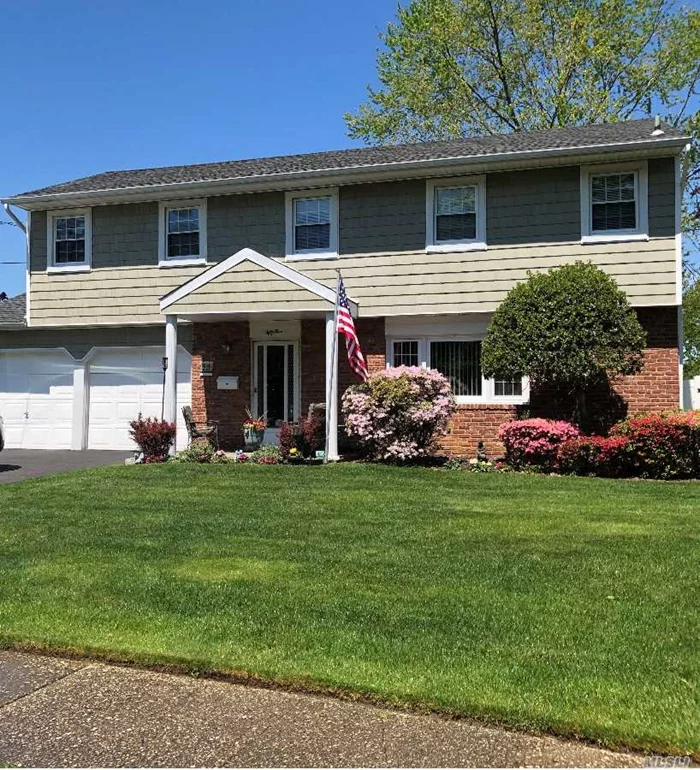 Dont miss this 4( Nice size) bdrms/2.5 bth. Nicely updated Colonial. Immaculate and move in ready. All wood flrs. Gas heat /stove. New EIK,  new burner and CAC. Large/Park like, fenced in back yard w paved patio.