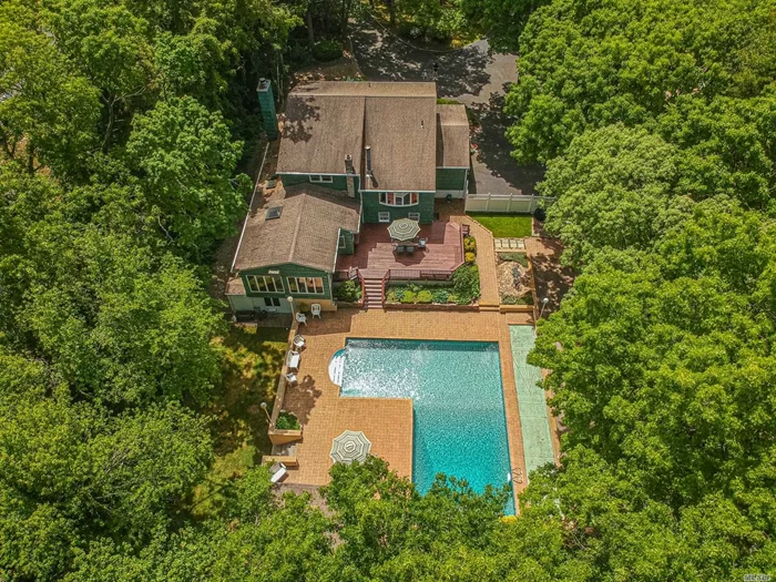 This Beautiful Spacious Colonial is Set Back from the road by a generous circular Driveway with plenty of parking and privacy. This home is truly Resort-style Living; Featuring Gorgeous Deck overlooking Stunning private Grounds, In-Ground L shaped Pool (20x40with16x16 Leg), Cabana, Bocci, and Shuffle Board Courts. There is also plenty of open Grass space all surrounded by Lush Trees and plantings. Inside, this Home features Large Living Room w/fireplace, Spacious 19x24 Kitchen, Dining Room, Gorgeous Family Room with Vaulted ceilings views the backyard, with Sliders leading out to the Deck. A few steps up, there is a Billiard Room with wood burning stove and stunning views of the property. Upstairs boasts large bedrooms and bathroom and a Master bedroom with its own full bath. All this and room for extended family! This is a stunner and truly a once in a lifetime home!