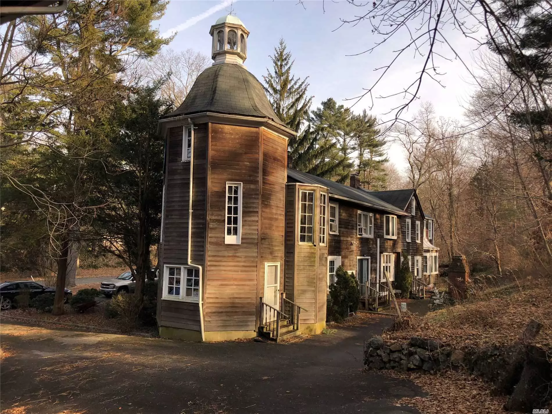 Charming Old World Flair, 6900 Sqft. Home with Slate Floors, Massive Unique Fireplaces, Original Clock Tower, 5 Bedrooms, 5 Full Baths on 2.96 Acres. Garage 3600 Sqft. Separate Structure with Storage, 6 Rooms/Bath. Can Accommodate 6 Cars. Endless Possibilities To Make This Your Dream Home. One of the Forty Original Estates from Early 1900&rsquo;S. Unique with Two Large Structures on One Parcel. Home Sold As Is.