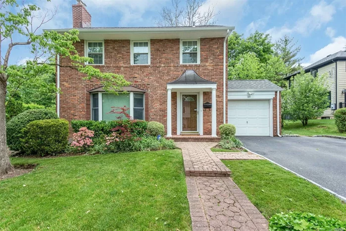 Solid Brick Classy Colonial in Plandom Height,  Renovated and Expanded Family room and Spacious Eat-in Kitchen with Granite counter top Island.  an Office with bay window,  Move in ready home, Near town, train,  secondary schools