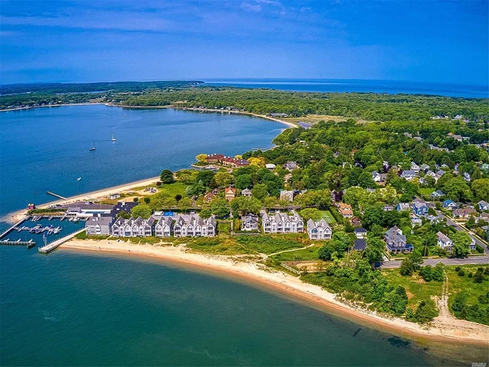 Bright And Airy Corner Unit Overlooking Shelter Island and Greenport Harbor. This 2 Bed 2 Bath Condo offers Vaulted ceilings, Master Bedroom with Master Bath with Access to Balcony, Fireplace in Living Room, Laundry and absolutely GORGEOUS WATER VIEWS!!!! This condo offers Tennis courts, pool, PRIVATE BEACH, Marina, BOAT SLIP that can dock up to 28ft Boat!! The boat slip is located in the best location!! Short Distance to LIRR and Historic Greenport Village. New A/C Unit and New roof! MUST SEE!!