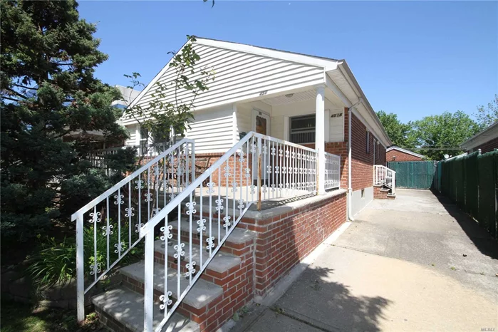 Brick ranch with front porch, detached garage and private driveway. Full finished basement. 2-zone has heat. Close to Northern Blvd.