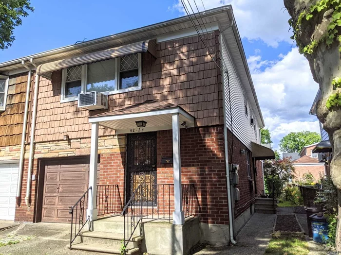 Beautiful Semidetached 2 Family in the prime area of Bayside. Close to LIRR Bayside station, buses- Q12, Q13 to Flushing, and QM3 to Manhattan. Close to Northern Blvd & Bell Blvd with restaurants and shops. Two electric meters, two gas meters. 3 entrances to the house. 1st Floor - 2 Bedrooms apt with attached garage. 2nd Floor - 3 bedrooms 1.5 baths apt. Basement full open with OSE.