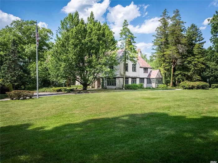 Significant Price Improvement!     A rare opportunity to acquire one of the few 3+ acre lots in sought after Harbor Acres section of Sands Point. This beautiful revival style stone Tudor is beaming with style and character of the 1920&rsquo;s inclusive of leaded glass and intricate woodwork.    As you stroll through the expansive grounds surrounded by mature trees and plantings you&rsquo;ll get a sense of how special and private this property is. Making your way through the manicured rose garden and down the long stone path you&rsquo;ll come across the 1, 000 SQF picture perfect cottage w/ fireplace tucked away within it&rsquo;s own beautiful back drop of greenery. This home is being sold-as-is and yearning to be brought back to what it once was to match it&rsquo;s truly special property.