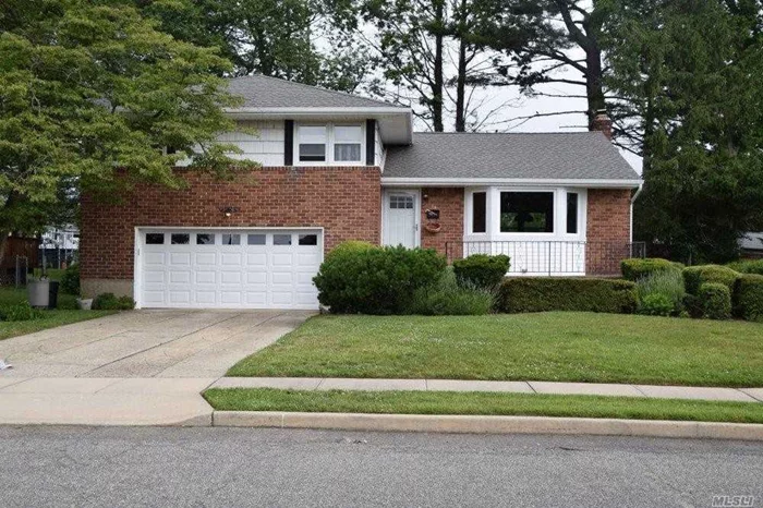 Who&rsquo;s Looking For A BrIck Split In North Hicksville In Move In Condition ? This Beauty Comes With A New Roof, Heating System,  Washer & Dryer, Garage Door & Exterior Doors ! Throw In Some Newer Siding, Replaced Windows, High Hats, Gleaming Hardwood Floors Up And Down, Plenty Of Closets & Storage, Fully Fenced (Pvc) Rear Yard With Super Curb Appeal With A Mid Block Location & More ! Your Search Will Come To An End !