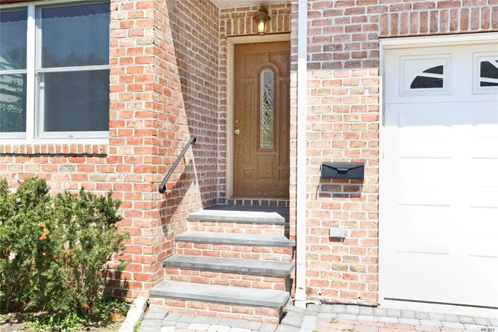 Beautiful sunlit spacious unit close to beaches and parks. The kitchem/great room is open with doors to the yard. There is a lower level for storage and 1 car garage.