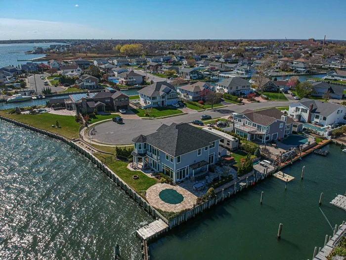 Spectacular bridge and bay views, Captree Landings Bayfront/canal, custom built Hampton style colonial, new 2001 3500sf, new bulkheading, 166&rsquo; on bay & 122 on canal, deep water docking, 12&rsquo; ceilings, wood floors, classic old world finishing, beautiful paver patios, BBQ system, heated inground, hot tub.