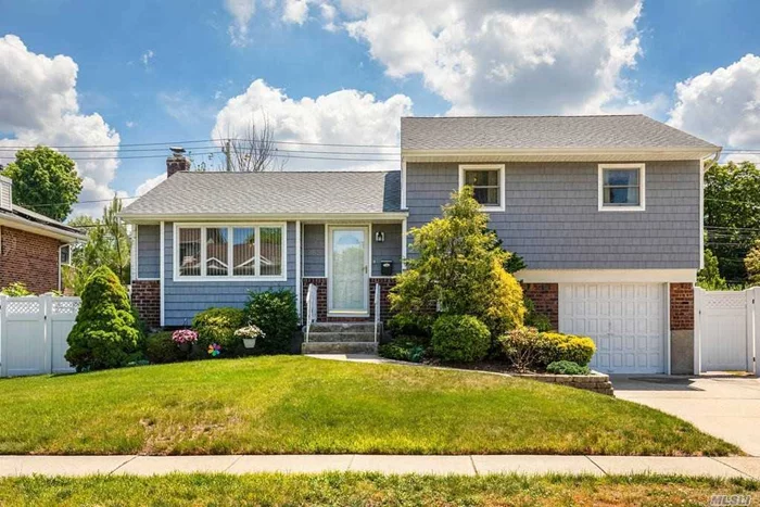 Welcome home to this beautifully maintained home in the Syosset School District. Many many updates and renovations: newly polished and stained hardwood floors, Anderson Windows, roof, siding all 6 years young, house painted in 2011, kitchen floor redone in 2014, gas conversion/boiler in 2013, hot water heater replaced in 2013, chimney liner replaced in 2014, bannister replaced in 2020, central A/C -2014 including in basement, washer/dryer - 2011, new crown moulding in bedrooms, patio pavers - 2013, PVC fence 2013. Yard is gorgeous and fully fenced!!