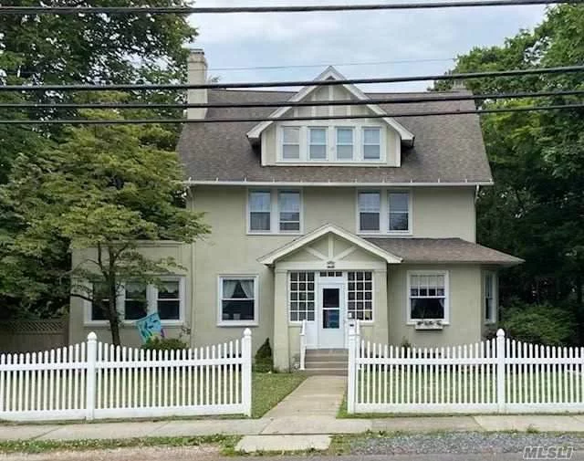 Gorgeous Colonial Circa 1915 Close to Town and Beach! Featuring Formal Entry, Formal Living room with fireplace, Formal Dining Room, Eat in Kitchen, Sunroom, 4 bedrooms 2 baths, Walk up 3rd floor with Formal Library/Great room! This is the one you have been waiting for!