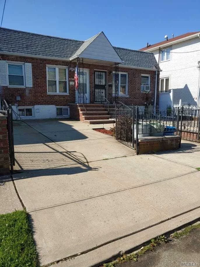 Solid brick Bayside home features 2-3 bedrooms,  hardwood floors. full finished basement with walk out central air Gas heat, private parking, fenced in yard School district 26. near trans / shops  Move right in!