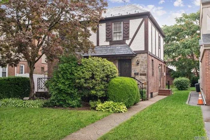 ***Welcome Home***To This Brick & Stucco Tudor Style Colonial Featuring Hardwood Floors Throughout Sitting On A 40 X 100 Lot Size On A Quiet Tree Lined Street Featuring Spacious Living Room And Formal Dining Room Perfect For Family Gatherings & Entertaining Inground Sprinkler System... Conveniently Located Near All: Transportation, Express Buses To Manhattan, SD 26, St. Johns University, Shopping, Restaurants, Houses Of Worship...And More...