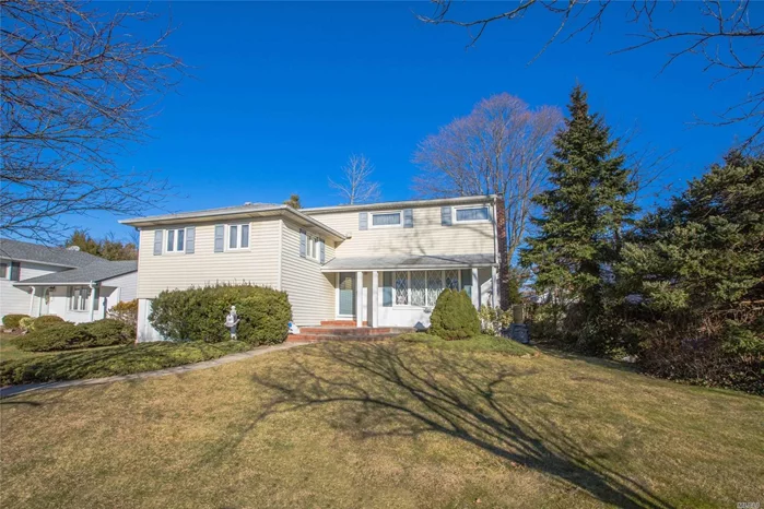 Lovely Expanded Split Located In N. Syosset. High Ceiling In Foyer With Marble Floor, Extended Eat In Kitchen With New Marble Island And Formal Dining Room, Sliding Door To Huge Deck, Bright 2nd Living Room On 4th Floor Can Be Converted Back To 5th Bedroom Easily, Newly Upgraded Boiler, Walkable To LIRR & Shops. Move In Condition.