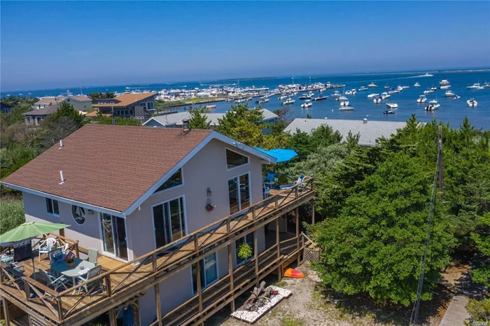 Location, Location, Location! Centrally Located Between The Ocean And The Bay. Open Floor Plan. Wrap-Around Deck. Boat Lovers Paradise.