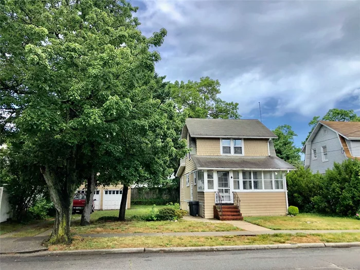 Huge potential! Large property in a great location. Quiet block, plenty of room for expansion, 2 car garage, large eat in kitchen, hardwood floors. Updated bath. Owner is a contractor and is willing to build to suit. Full new construction is possible on this beautiful lot.
