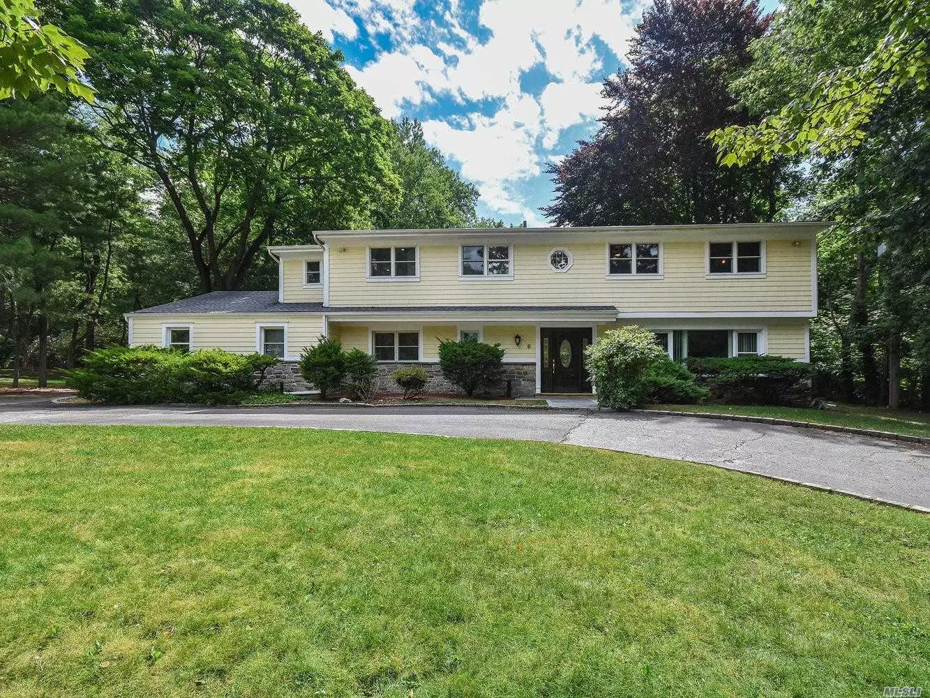 Dramatic Balcony Colonial with wide open feel and a perfect layout for an easy lifestyle. Ready to move in. Large open living room and dining area with vaulted ceilings. EIK with oversized center island. Granite counter tops and state of the art appliances. Den/family room and extra bedroom/office with bath on first floor. Glass sliders from kitchen and LR to deck and large park like property with in ground pool As Is. Second floor has 4 bedrooms. A master/mbth, a bedroom with ensuite bth plus 2 additional bds with bth. So many major improvements recently done: Windows throughout, roof, cedar shingles/stonework, Kitchen, 1st floor hardwood floors all remodeled bathrooms, and more.