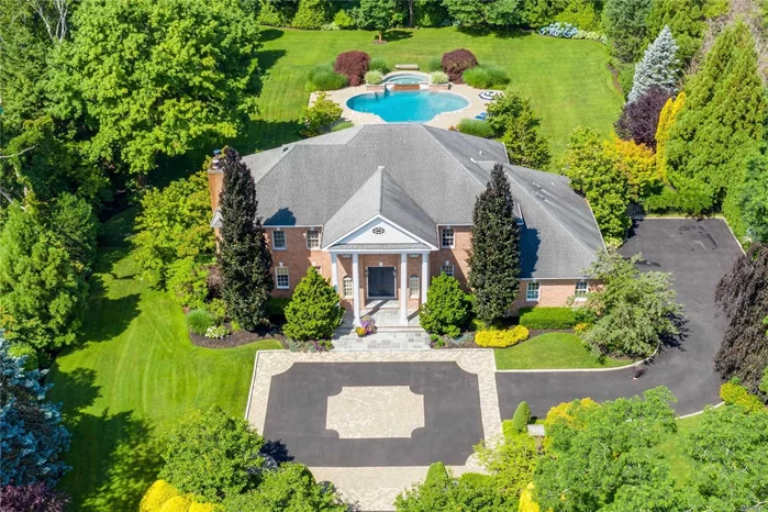 Mint Location. Center Hall Brick Colonial set on 2 lush acres of incredible grounds and set on a private tree lined cul-de-sac. Every room throughout the home has been incredibly customized to perfection and boasts 5400 sq. ft. of luxury living space. Some of the many features include 5 Br&rsquo;s, 6.5 Baths, open floor plan, elegant two story entrance hall, Formal Lr w/ f.p, Formal Dr, Family Rm, Gourmet EIK w/breakfast nook & all new appliances, office, Maids quarters w/bath & laundry Rm and a full finished basement with a state of the art gym, game room, den, sauna and steam room. A 3 car attached garage and the In-Ground heated gunite Pool & Spa complete this luxurious family residence. TRULY A MUST SEE. 5 minutes to LIRR, shopping and restaurants and 45 minutes to Manhattan. Showing start on Monday 7/6