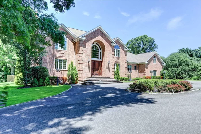 Long Island Luxury Lifestyle at it Best! Handsome Wrought Iron Gates Open to the Courtyard of this Magnificent Brick Colonial set on a Private Tree Lined Street in the Famed Village of Old Westbury. Dbl Doors Open to an Elegant Reception Room with Soaring Ceiling & Floating Mahogany Staircase that flows Seamlessly into The Heart of the Home. Built with Entertainment in Mind, It Offers Generous Principle Rooms, an Expansive Great Room Adjacent to the Custom Chef&rsquo;s Kitchen with Lots of Room for Food Prep & Gathering Around the Spacious Center Island and En-Suite Bedroom complete the 1st Flr. The Master Suite has an Abundance of Space with Additional Sitting Room, Custom BI Wardrobe Dressing Rm & Luxurious Bath.3 Additional Bedrms, 2 Full Baths & Bonus/Game Rm are featured on 2nd Flr. The Lower Level is a continuation of Beautifully Finished Living Space w GraniteFlrs, Beautiful Kitchen w Glass Inlaid Backsplash, Gym, Full Bath, Office, Outside Entrance. Sparkling IG Pool, 2 Beautiful Acres.