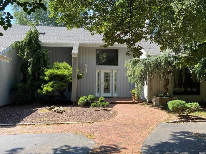 Located in a quiet, mid-block location in highly sought after Mills Pond Estates, this 5BR, 3.5 BA home is of the largest in the neighborhood! Step into the luxurious, spacious two-story foyer and enjoy the ease of the open floor-plan. The seamless Hardwood floors, and country club property are just a few of the things that make this a magnificent home. First floor offers an amazing home office/ guest quarters with private full bath, and entrance into 3 car garage. Sit by this gorgeous dual fireplace, and enjoy one of the few homes to have a front and back staircase. The second floor master en-suite is breathtaking with vaulted ceilings and a newly renovated stunning master bath. Roof 2013, updated windows, young AC units. Great opportunity to be in this very desirable neighborhood!