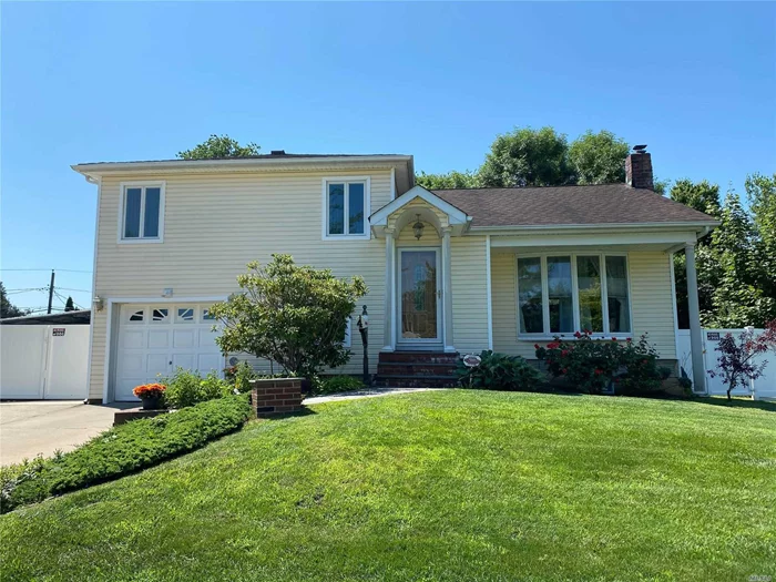 Taxes are $11, 945.14 with basic STAR. A hidden gem in Syosset! Close to park & elementary school! Spectacular curb appeal and tons of updates! New CAC, 2010 Natural Gas, very efficient, tankless heating unit!! 4 year old kitchen appliances, whole house reverse osmosis water filtration system. 10 year old roof with lifetime warranty. Large slider in dining room slides out to small deck in large backyard. Finished basement with Cedar closet. security alarm to central station. This home will not last! Call now!!