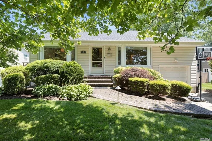 Great opportunity to move right into to this gorgeous front to back split in Syosset! 4 Bedrooms plus an office & 2.5 Baths. Open floor plan allows for great entertaining! High vaulted ceilings in oversized Living Room, wood floors and open floor plan in kitcehn and dining room create an amazing first floor. All large bedrooms,  Newer bathrooms. 3rd Floor office, perfect for working at home. Spacious Family Room with fireplace with sliders to flat, oversized property. Finished Basement. 1 Car Garage. Syosset Schools. Unbelievable Value!