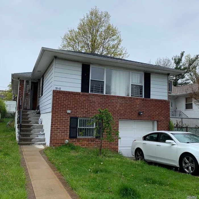 Beautiful and Bright Single Family Home In Bayside. This Home Has Been Renovated. New Eat-In Kitchen and Formal Dining Room, Hardwood Floors. The Lower Level is Family Room, Office, Bath, And Laundry. New Roof And Walkway. Fenced In Yard. Close To All Transportations, Lirr, Buses.Must To See!