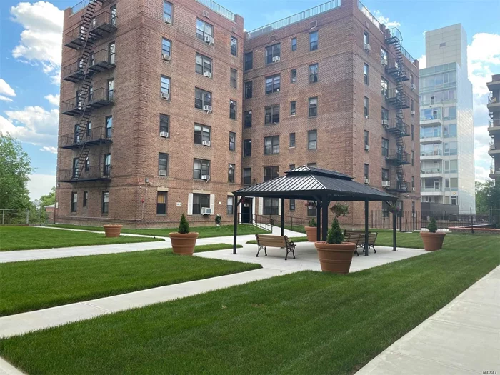 Large 1 BR Unit In Great Condition, Center Of Flushing, On The 6th FL, Very Quiet & Very Bright, Wood Floor Through-Out, 4 Blocks To Main ST, Close To Shops, Transportation & Supermarket, Convenient To All. Laundry Rm In Basement, Pets Allowed, Building Great-Maintained. Southern & Western Exposure. Indoor Parking (131.25/ Per Month) And Outdoor Parking (106.25/Per Month).