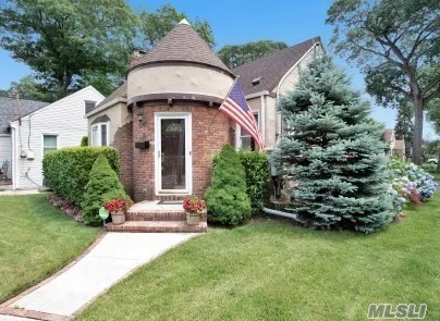 Beautifully kept Tudor Cape in heart of Westwood Section of Lynbrook.  Lr, FDR, kit, 3 bedrooms, updated full bath, 2 fireplaces (1 wood burning and 1 electric). CAC, updated windows, 4 zone sprinklers, fully fenced in yard. Finished basement for extra entertaining space. Close to LIRR, shopping, highways and schools. Taxes with current STAR = $9531.85