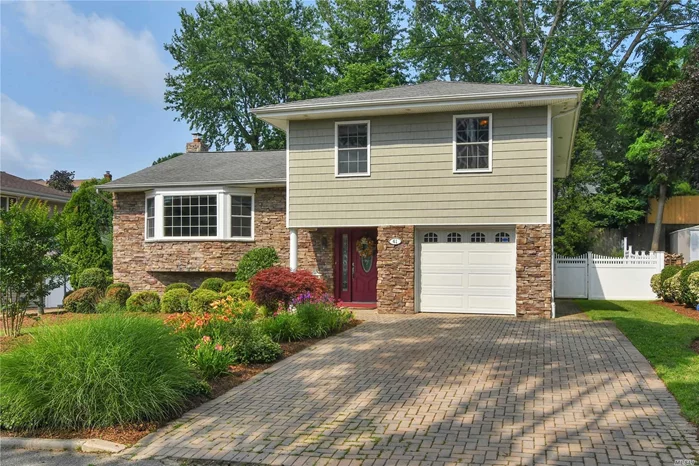 Move right in to this turn key, totally updated, sensational split with dramatic columned entry. The living room with a vaulted ceiling and stone fireplace enhance the drama of the entry. Gleaming hardwood floors throughout. The kitchen is totally updated with granite counter tops and stainless steel appliances. There are four Bedrooms and two new baths. The sunny and bright den invites access to the patio and pool area. Great for summer entertaining. The lower level playroom/office is a bonus. Ready for immediate occupancy. Motivated Seller.