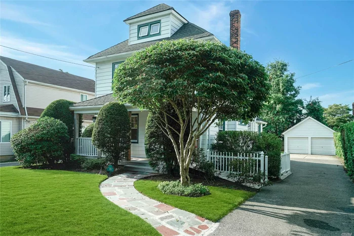 Beautifully renovated and meticulously maintained front porch Colonial set on deep flat property. Entry foyer leads to living room, spacious dining room, updated eat-in kitchen, full bath and laundry room. Second floor has Master bedroom, Two bedrooms and full bath. Walk up third floor bonus room. The lower level is finished with outside entrance and additional laundry. Other amenities include gleaming hardwood floors throughout, 2 zone gas heat, plus 2 car detached garage with extra storage. This wonderful home, convenient to town, schools, parks and public transportation, is a must see!