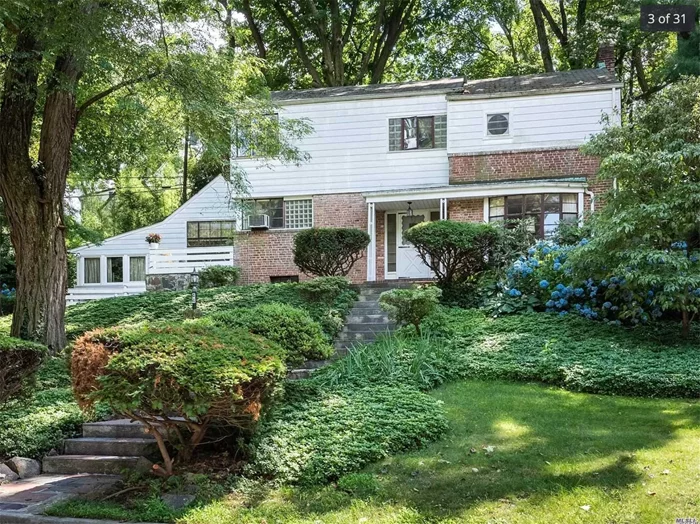 Lovely Colonial, 4BR, 3Bth home features FDR with easy access to EIK, and adjacent BR/Office and Full bth.Charming LR w/WBFP, oversized Great Rm w/Redwood log walls and wide plank oak floor + massive WBFP. Original Art Deco bannister leading to Primary BR/windowed dressing room, Full bath, walk in closet and porch. Additional 2 BR&rsquo;s in a separate wing and full bth and closets with builtins. Multiple patios/terraces for outdoor enjoyment. GNE waterfront park, optional school zone.