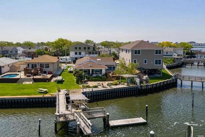 The Most Spectacular Sunset Views!- On the Harbor Isle Pointis where you&rsquo;ll find this One of a kind Custom Bayfront Ranch.Boasting 3 Bedrooms & 3 Bathrooms, Sunlit Den overlooking Bay with Dock, Deck, Float & Ramp, New Bulkhead, -Widows Galore with Incredible Views!!