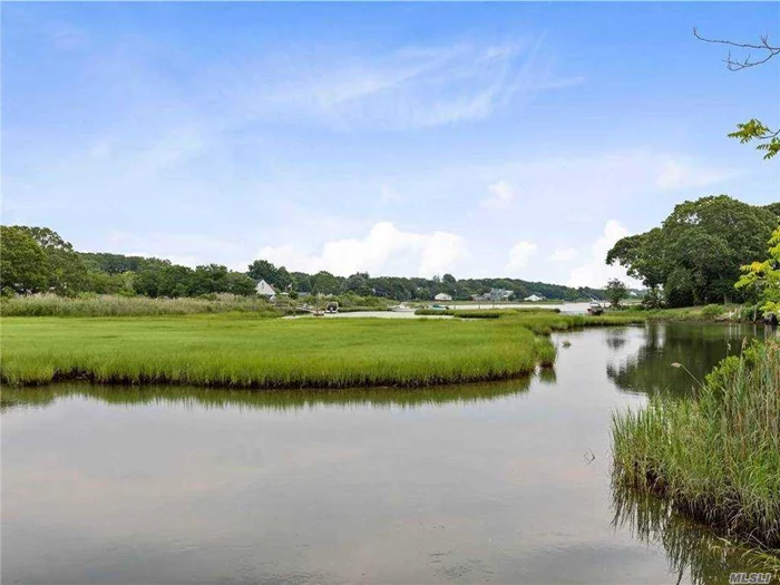 Location, Location, Location! Welcome to the beautiful Laughing Water community in Southold. Imagine picnics overlooking the bay where you can launch your kayak or dock your boat, and a lovely deeded beach and town beach nearby. This is the life you can live here in this quaint Southold location. This unique home has a modern innovative design offering 3 bedrooms, plus bonus room above the garage for possible art studio, office or 4th bedroom. It also features a full basement, garage, and a sunny spacious great room that opens to a gorgeous private backyard with plenty of room for a pool. With a little tender loving care, this home will shine perfectly! Must see soon so you can enjoy the beach before winter!