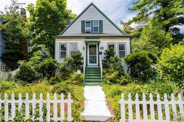 Charming Bright Cape in the Heart of Town Featuring EIK , Living room , Dining Room, 3 Bedrooms, 2 full Baths, Full Unfinished Basement, Enclosed Porch, Private Driveway S.D #20 Close to LIRR/Shopping/Park