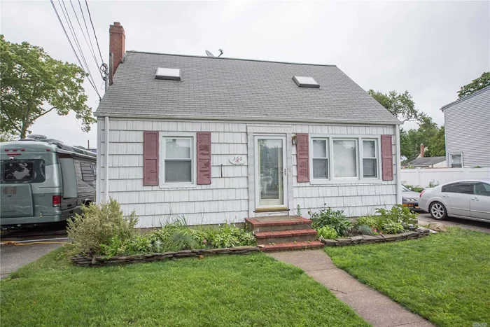 Cute Village Cape w/Hardwood Floors, Full Basement and 1 Bedroom Apartment, 2 Car Detached Garage, Lots Of Off Street Parking. 2 Family Owner-Occupied w/ Permit