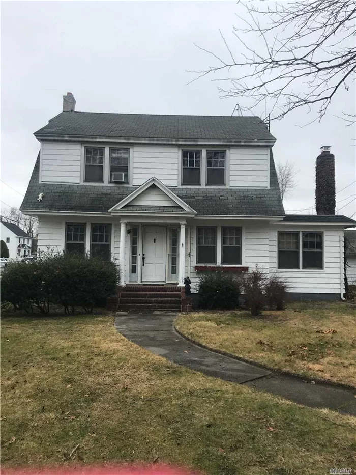 Great Investment Opportunity! Property on Double Lot! Islip Schools -walk to town-Large Rooms w/ Harwood Floors Throughout- Working Fire Place. Good Bones -Great Opportunity