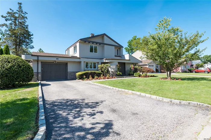 Beautiful redone center hall colonial. This home has large rooms with a sunny open layout. The house is equipped with a full solar panel roof and dual unit ac and heating units in every room. Wonderful new kitchen with center island and new appliances. Elegantly landscaped with in ground sprinkler . Situated in the private community of West Park, convenient to all shopping, highways, and entertainment.