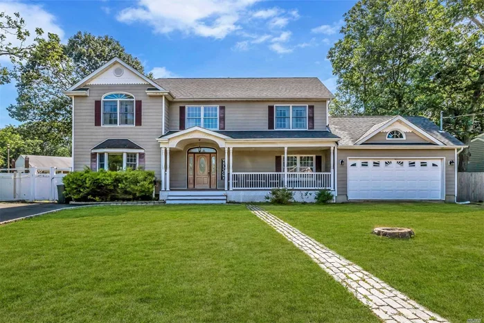 Welcome to this 4 Bedroom 3 Full Bath home located South Of Montauk, Front porch, Wood floors through out , Living room with Fireplace,  Huge space on lower level including Garage Conversion. All nestled on Cornet lot.