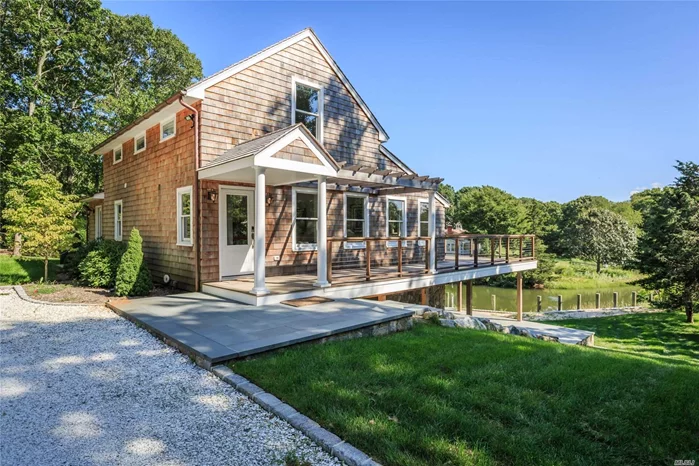 Beautifully Fully Renovated Property With Gorgeous Water View And Dock. Custom Landscaping And Sea Shell Driveway. Large Deck Perfect For Entertaining, Master Bedroom Overlooks The Water W/ Access To Outside Balcony. The Home Has A Great Amount Of Natural Light Making The Interior Vibrant And Cozy. This Is A Must See!